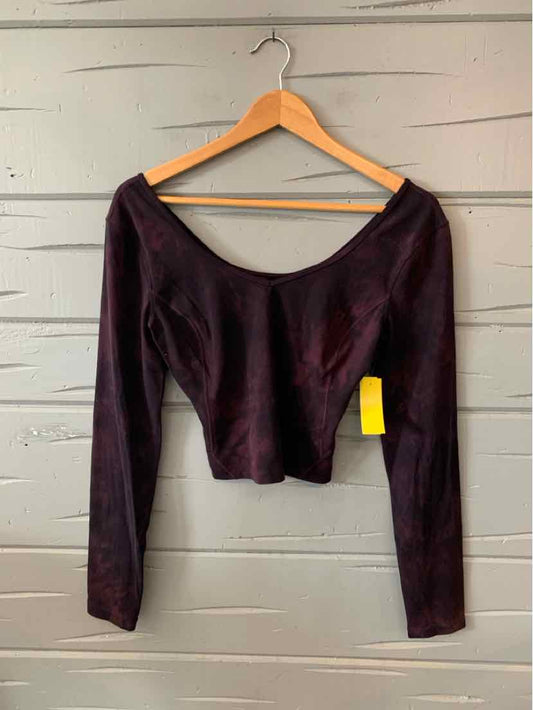 Long-sleeve cropped top in deep burgundy with subtle tie-dye effect and scoop neckline.