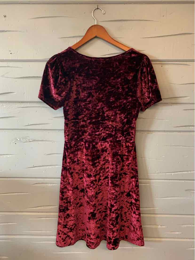 Burgundy and black crushed velvet short-sleeve dress with a relaxed fit and subtle hem ruffle.
