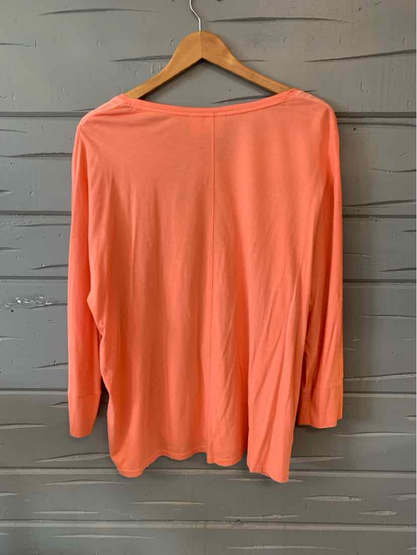 Solid coral long-sleeve blouse with boat neckline in size 2XL hanging on wooden hanger.
