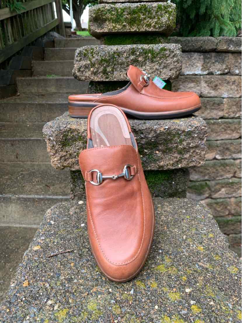 Brown leather slip-on mule shoes with silver buckle detail and smooth rounded toe, size 39.