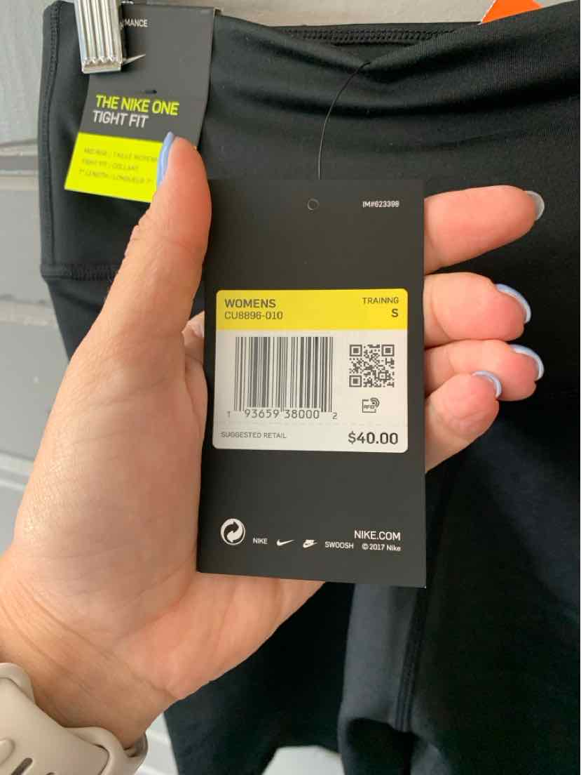 Black Nike athletic leggings with size small tag and retail price of $40 hanging on display.