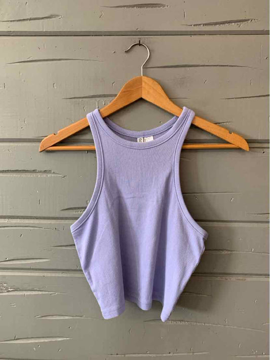 Lavender ribbed sleeveless crop tank top with wide armholes on wooden hanger.