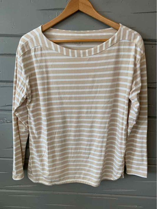 Tan and white striped long-sleeve shirt with a wide neckline and relaxed fit on wooden hanger.