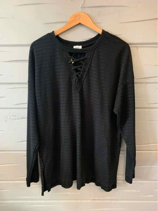 Black long-sleeve shirt with lace-up V-neck and subtle horizontal stripe texture, size XXL.