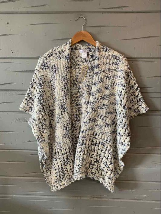 Loose knit cardigan in wool blend with an open front and mixed white, black, and beige yarns.