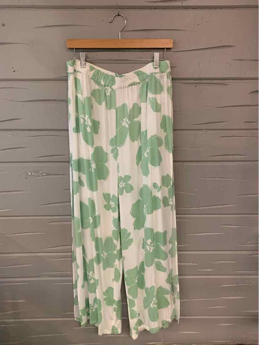 White wide-leg pants with large green floral print, size XL, lightweight fabric.