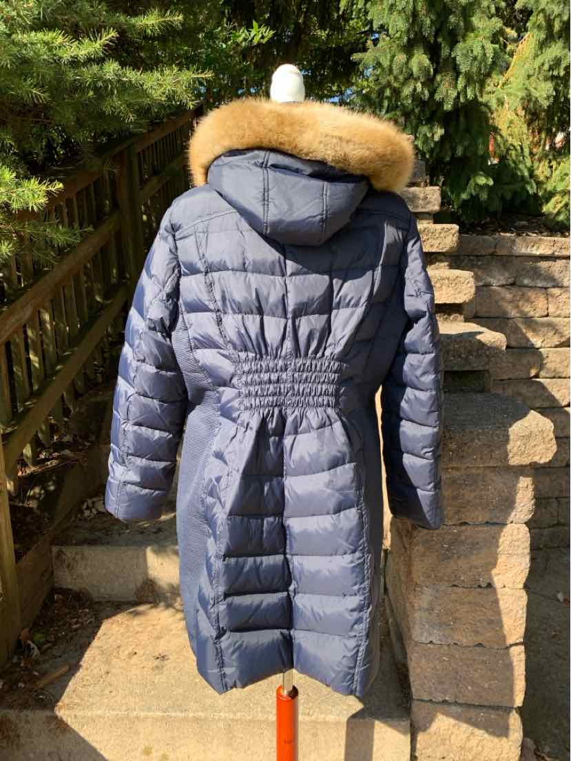 Women’s charcoal gray quilted puffer coat with a fur-trimmed hood and cinched waist, shown from the back.