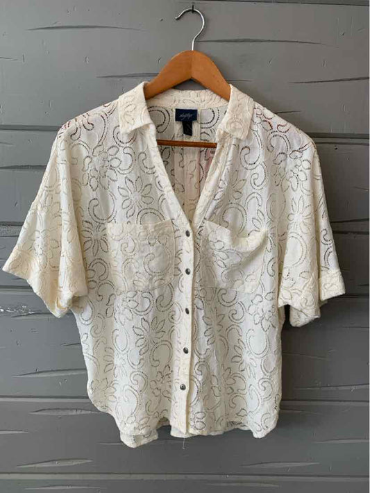 White semi-sheer lace short-sleeve blouse with collar and button-down front.