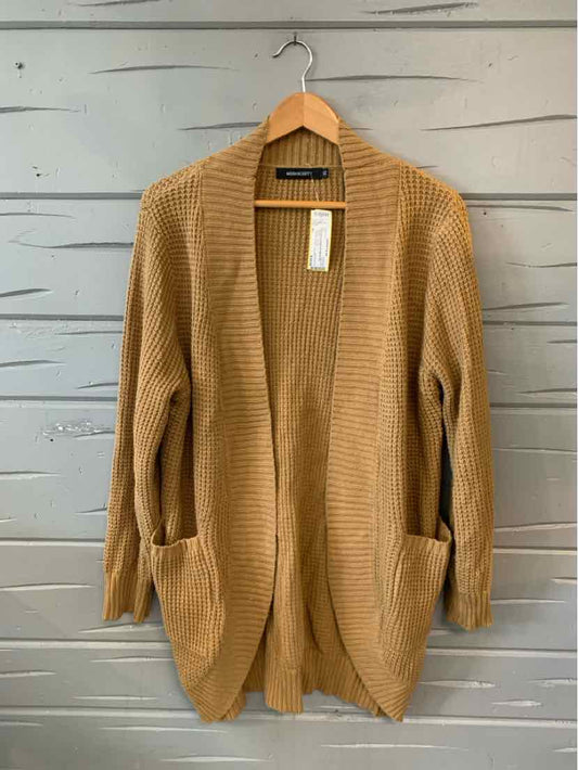 Tan open-front knit cardigan with ribbed texture and two front pockets, size XL.