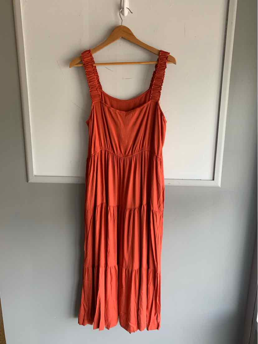 Rust orange sleeveless tiered maxi dress with ruched straps and a square neckline.