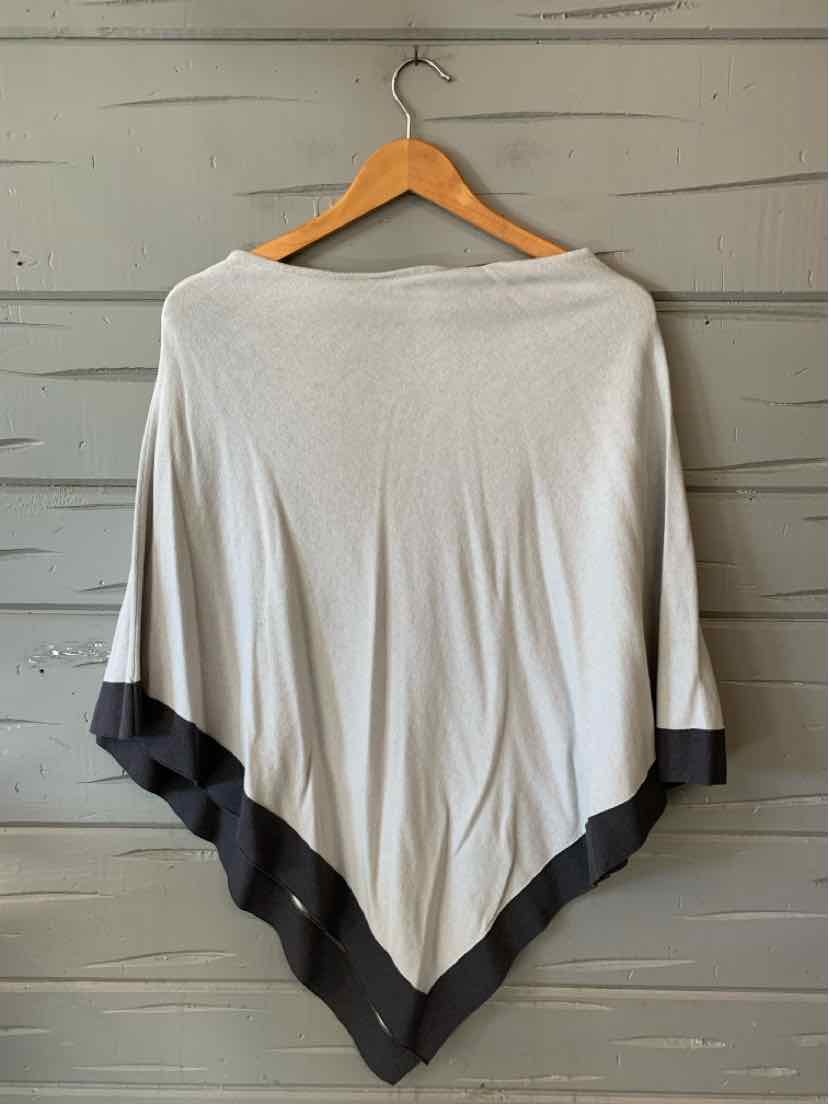 Light gray poncho with wide black border along the hem, soft flowing fabric, loose fit.