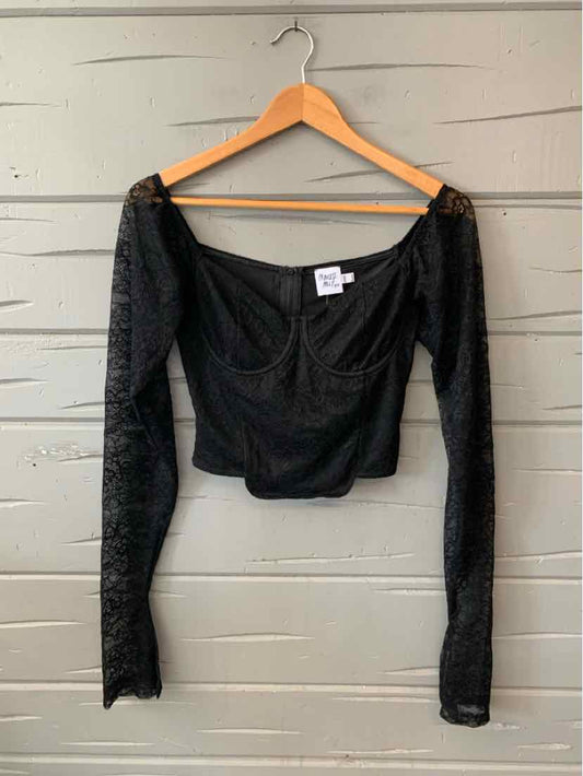 Black long-sleeve lace crop top with sweetheart neckline and fitted silhouette.