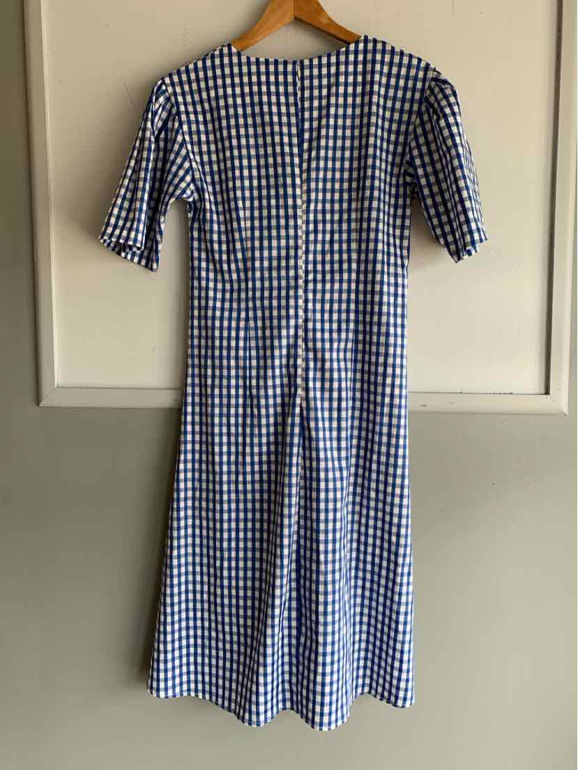 Blue and white gingham midi dress with short sleeves and a fitted waist on a wooden hanger.