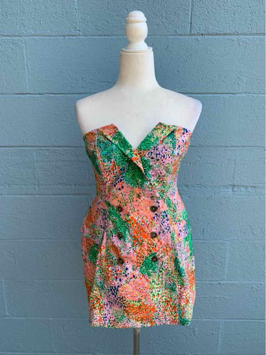 Strapless mini dress with vibrant multicolor floral and abstract print, fitted silhouette.