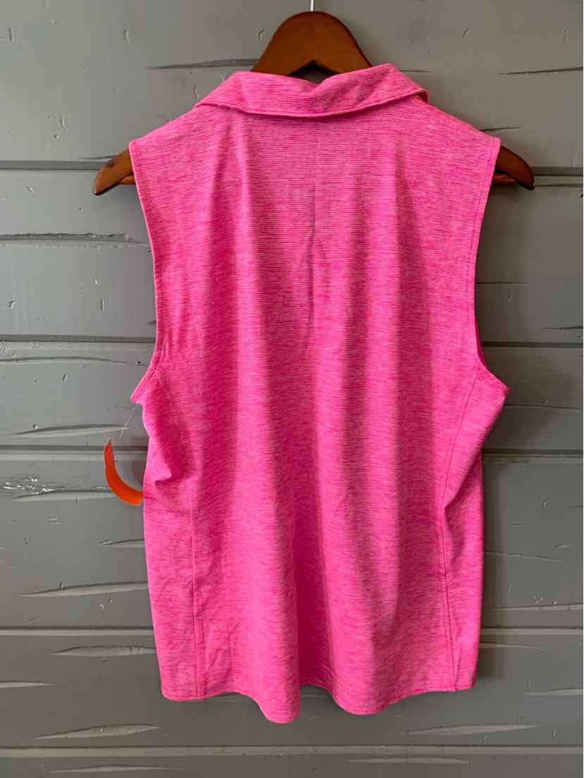 Sleeveless bright pink polo shirt with soft textured fabric hanging on wooden hanger.