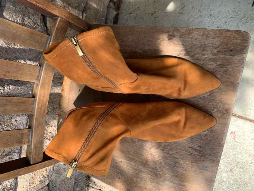 Tan suede mid-calf boots with pointed toe and side zipper, size 8.5.
