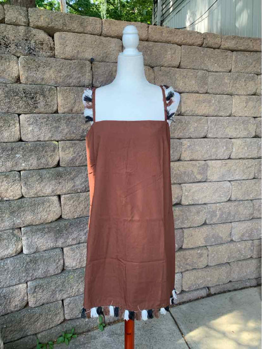 Brown sleeveless dress with square neckline and multicolored tassels on hem and straps.
