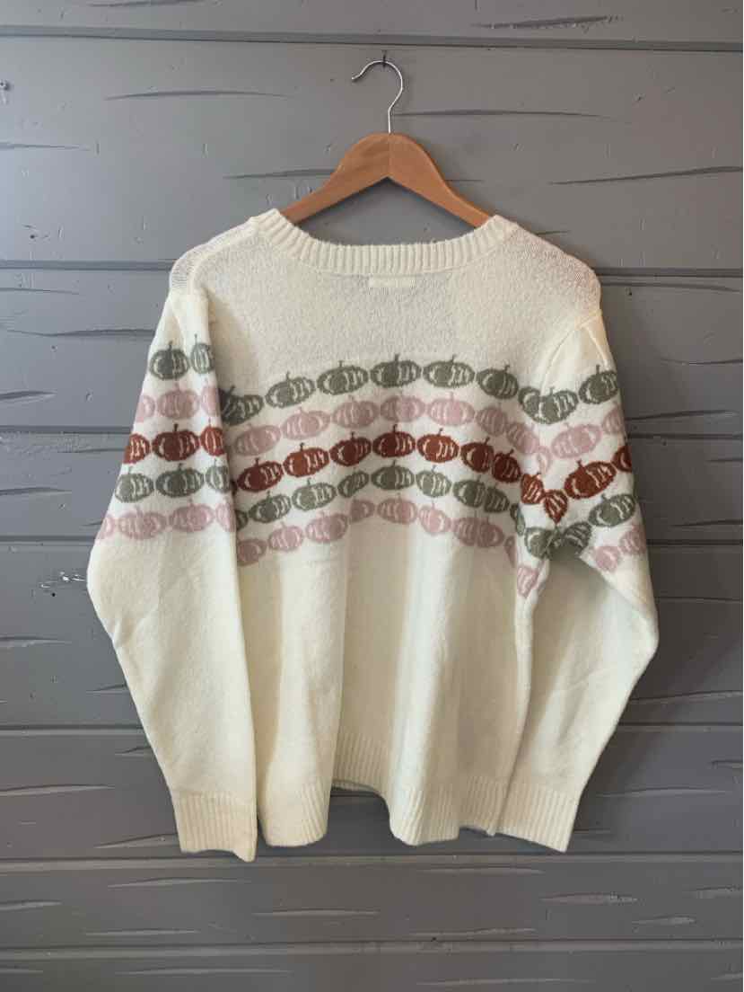 Cream knit sweater with horizontal rows of small multicolored pumpkins across the chest and arms, size XXL.