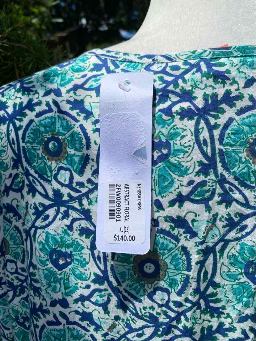 Blue and green paisley patterned fabric in XL size with white price tag attached.