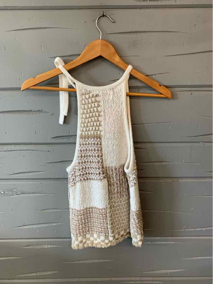 Cream and beige sleeveless knit tank top with color block pattern and textured stitching.