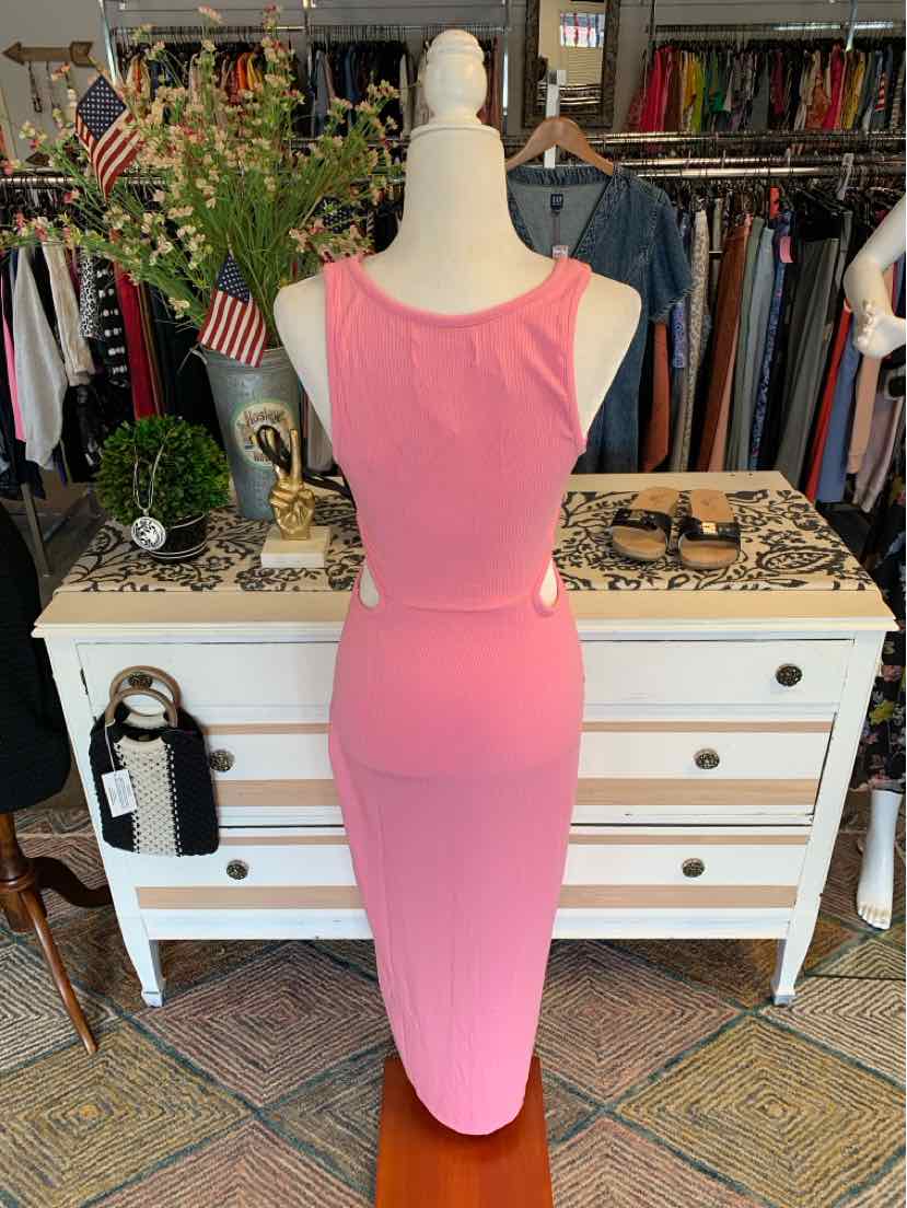 Sleeveless solid pink midi dress with a fitted silhouette and scoop neckline on a mannequin.