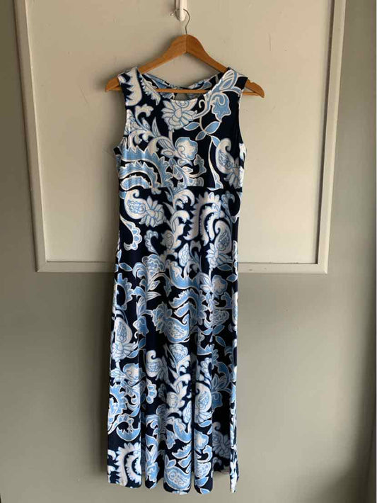 Sleeveless midi dress with black, white, and light blue floral paisley pattern, fitted waist, round neckline.