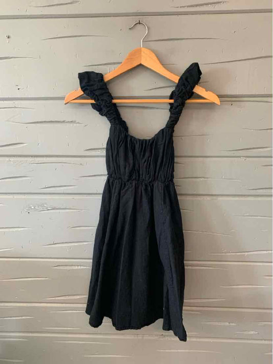 Black sleeveless dress with ruffled straps and gathered bodice in size XS.