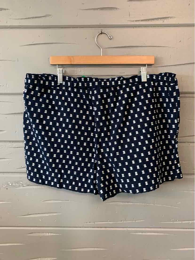 Navy blue shorts with white geometric pattern, elastic waistband, casual style.