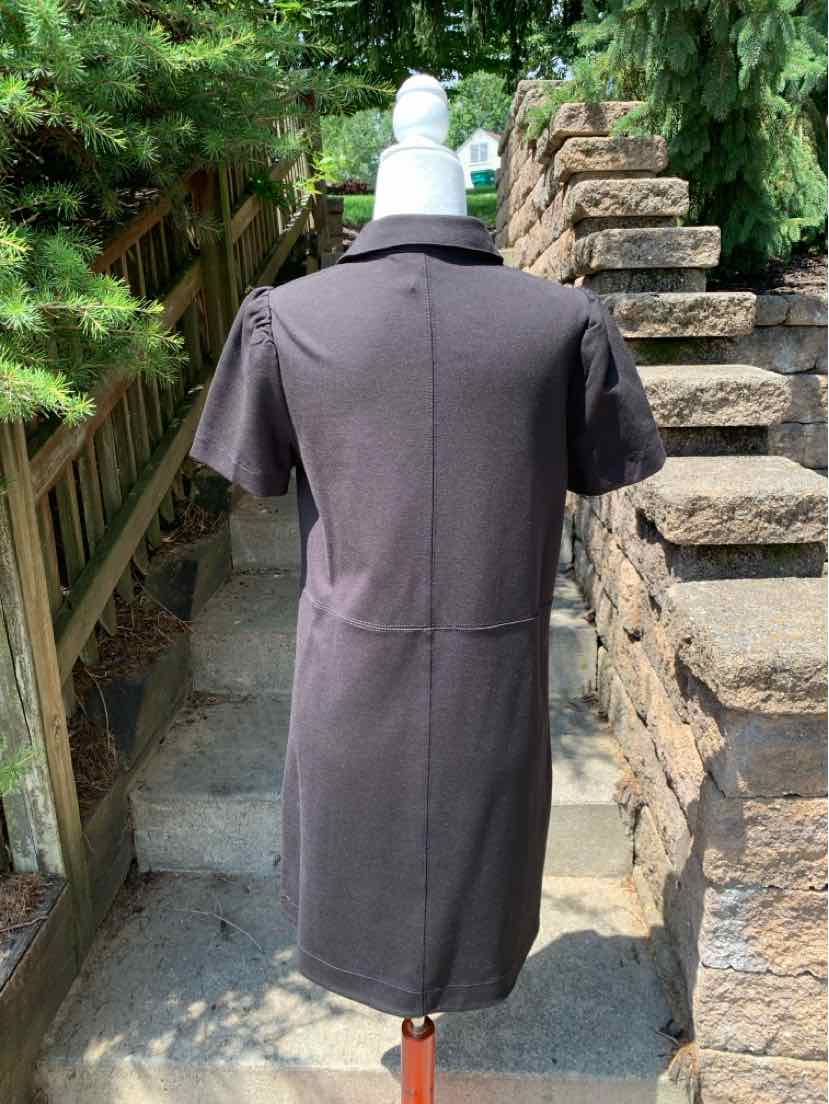 Black short-sleeve knee-length dress with seam detailing and a fitted silhouette.