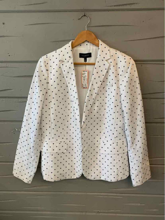 White blazer with black polka dots, notch collar, single-button closure, long sleeves, tailored fit.