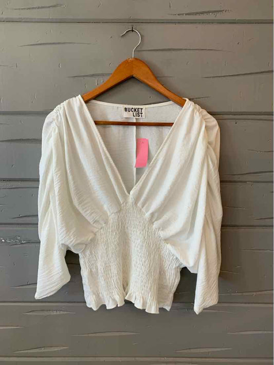 White long-sleeve blouse with deep V-neck and gathered waist, size medium.