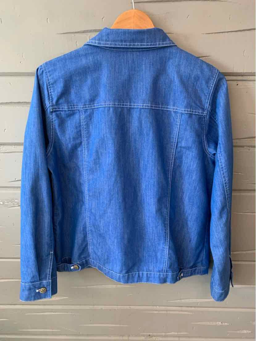 Classic medium blue denim jacket with long sleeves, collar, and buttoned cuffs shown from back.