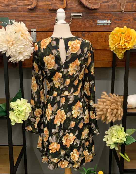 Black floral dress with yellow and beige flowers, long sleeves, keyhole back, and cinched waist, size small.