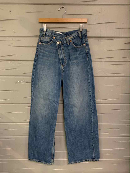 High-waisted blue denim jeans with button fly and straight leg cut, size 6.