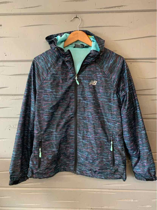 Women's New Balance lightweight hooded jacket in dark multi-color pattern with zip pockets and teal lining.