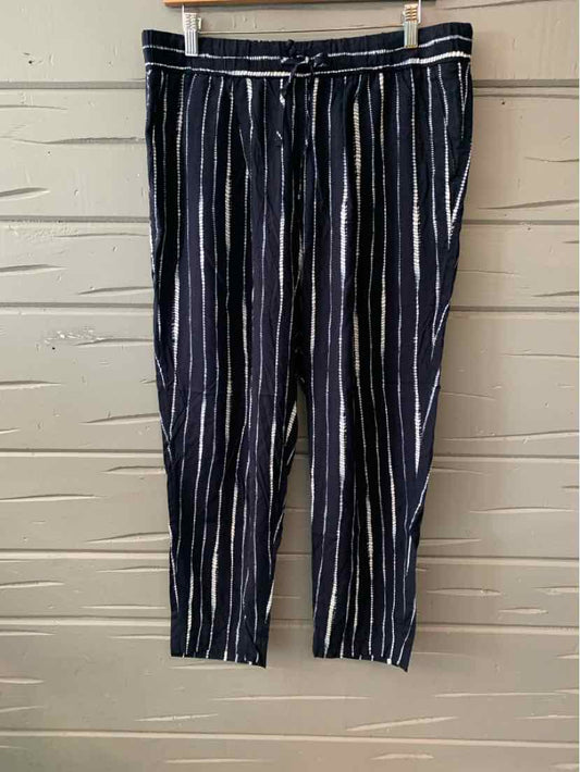 Black pants with vertical white and light blue stripes, elastic waistband, and relaxed fit.