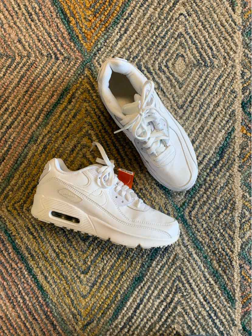 White Nike Air Max sneakers with cushioned soles and mesh accents, women's size 8.