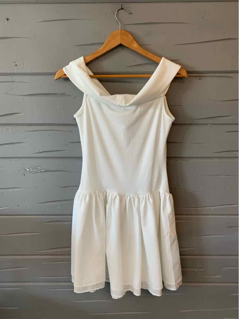 White sleeveless dress with wide straps and a gathered waist on wooden hanger.