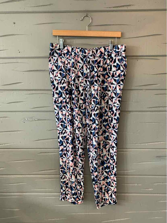 Slim-fit pants with blue, white, and pink abstract floral pattern on lightweight fabric.