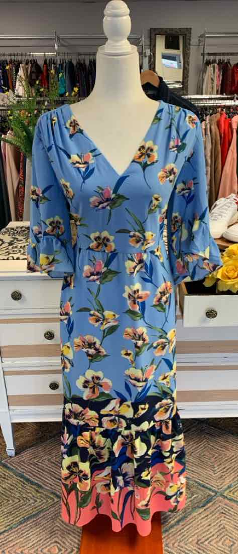 Blue floral maxi dress with V-neck and 3/4 sleeves on a mannequin.