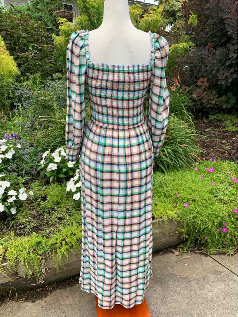 Long plaid dress with puffed long sleeves, square neckline, and smocked back, featuring green, pink, and white colors.