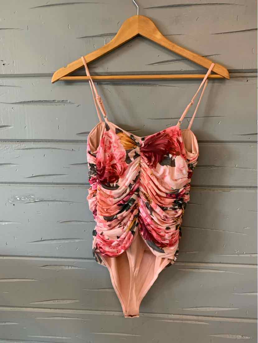 Pink floral ruched one-piece swimsuit with thin adjustable straps and a sweetheart neckline.