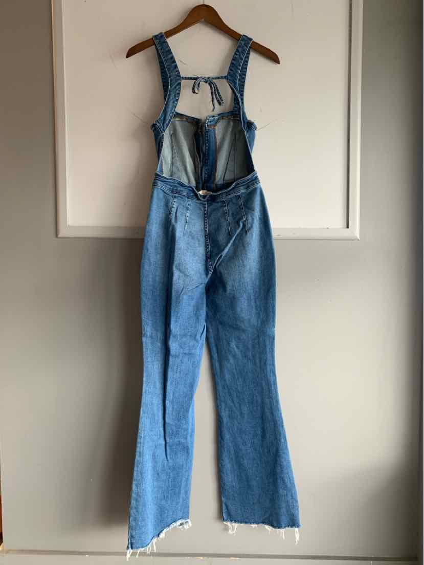 Blue denim overalls with adjustable shoulder straps and front bib pocket, frayed wide legs.