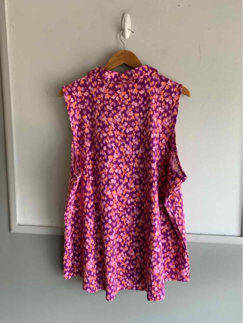 Sleeveless flowy blouse in pink, purple, and orange floral print with a back keyhole detail.