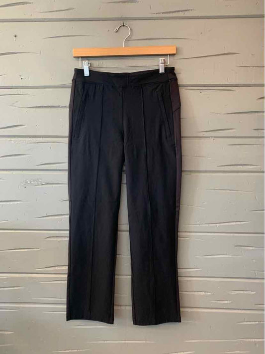 Black Athleta women's straight-leg pants with a smooth finish and fitted waistband, hanging flat.