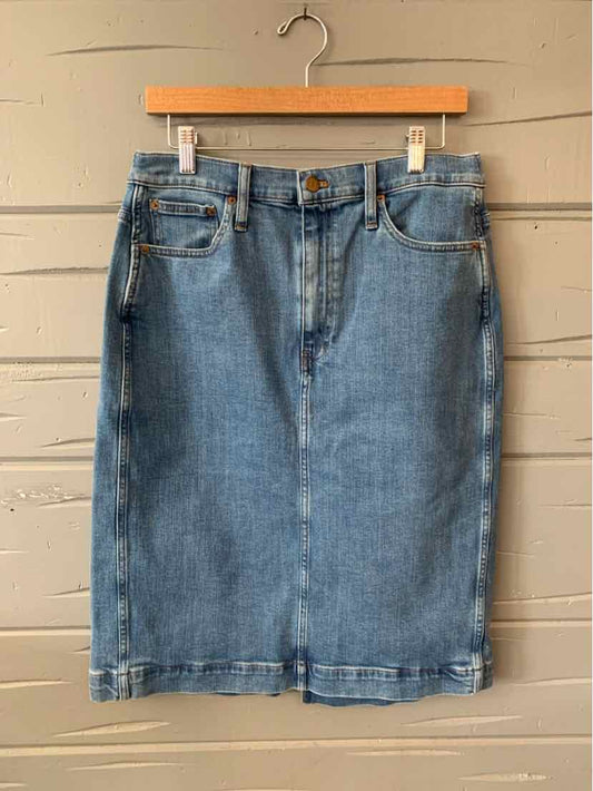 Mid-length blue denim skirt with front pockets and button closure, size 10.