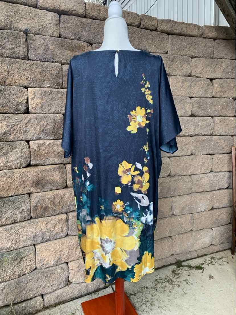 Navy blue floral dress with yellow and white flowers, loose fit, knee-length, short sleeves.