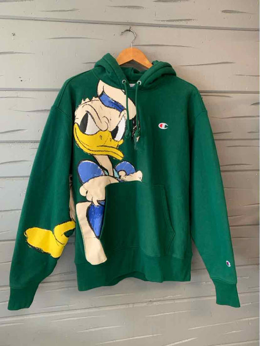 Green Champion hoodie with front pouch pocket and large Donald Duck graphic in blue and yellow.