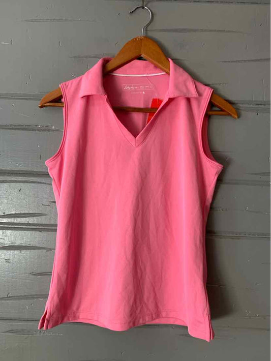 Sleeveless pink polo shirt with collar and side slits on wooden hanger against gray wooden background.