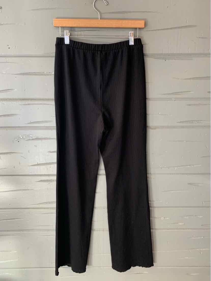 Black solid pull-on trousers with a wide waistband, straight legs, and subtle side slits at the hems.